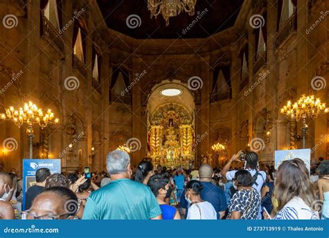 hundreds of catholic faithful are praying during the homage to nossa senhora da conceicao da