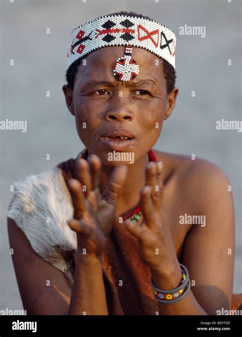 namibia eastern bushmanland tsumkwe a kung woman sings and claps her hands to the rhythm of
