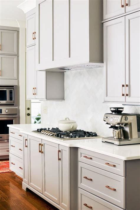 White is a timeless color choice, and sure to brighten up any space for a fresh, clean look. Grsya Shaker Cabinets with White Quartz - Transitional ...