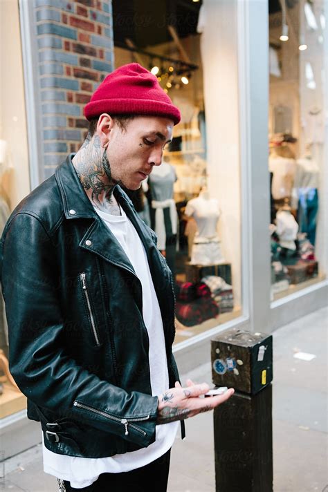 Punk Man Wearing Leather Jacket And Beanie Hat In London By Stocksy