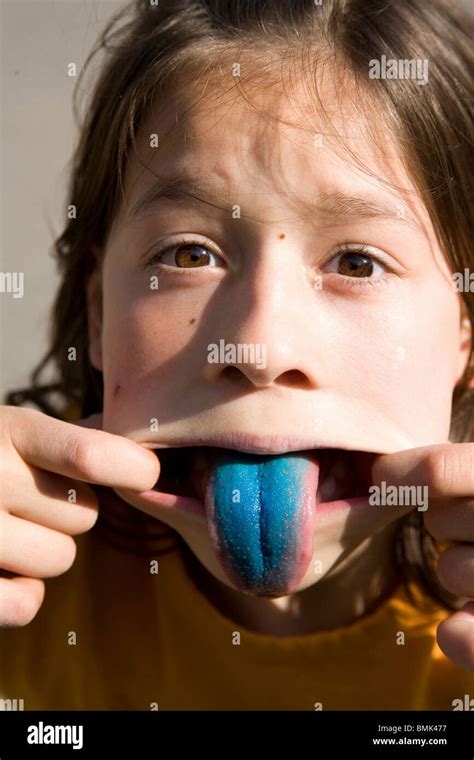 A Girl Sticking Her Blue Tongue Out Stock Photo Alamy