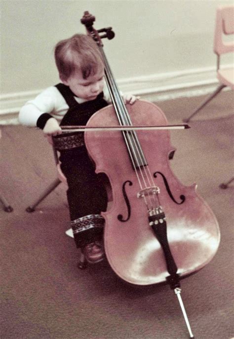 Child Learning How To Play The Cello At The Bradley Institute · Bradley