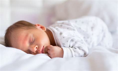 Newborn Baby Boy Sleeping In Bed The Queens Nursing Institute