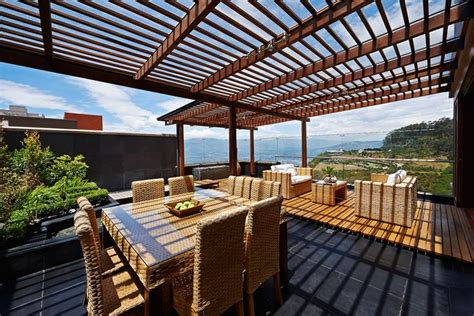 Rooftop Deck With Wood Pergola Outdoor Wicker Furniture And Ocean View