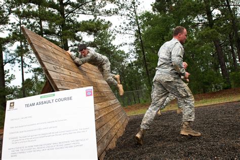 Paratroopers Compete In The Incline Wall Obstacle Event Part Of The