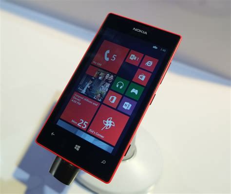 Red Nokia Lumia 720 On The Stand Wallpapers And Images Wallpapers