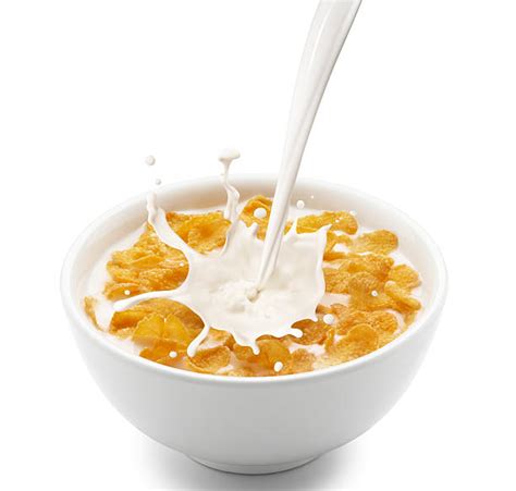 Pouring Milk On A Bowl Of Cereal Stock Photos Pictures And Royalty Free