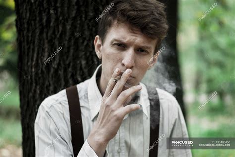 Young Man Smoking Cigarette — Guy Fashion Stock Photo 133480450