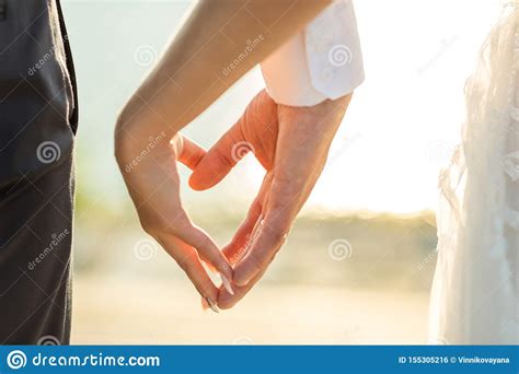 Close Up Of A Couple Love Holding Or Making Hand For Heart Shape As