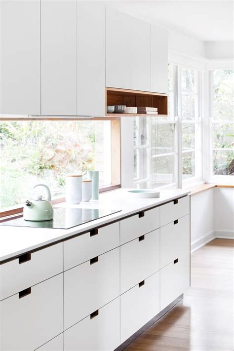 If a window cuts into the wall, pretend the window is not there and continue the backsplash around it to the normal stopping point. Hot Decor Trend: 15 Window Kitchen Backsplashes - Shelterness