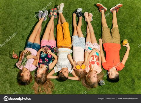 Group Of Happy Children Playing Outdoors Stock Photo By ©vova130555