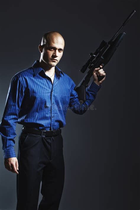 Handsome Young Man Holding A Gun Stock Photo Image Of Expression