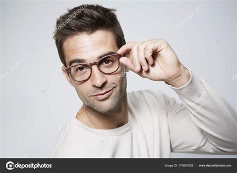 Handsome Man Adjusting Glasses Stock Photo By ©sanneberg 170891828