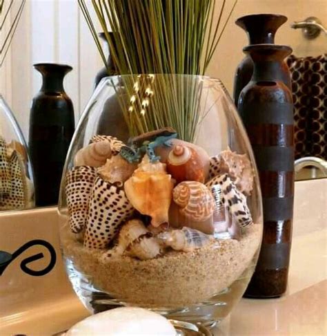 4.5 out of 5 stars. Shells in a vase | Shells and sand, Restroom decor, Beach diy