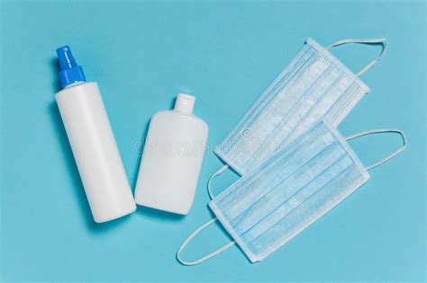 Medical Surgical Masks And Bottles Of Disinfectant And Alcohol Hand