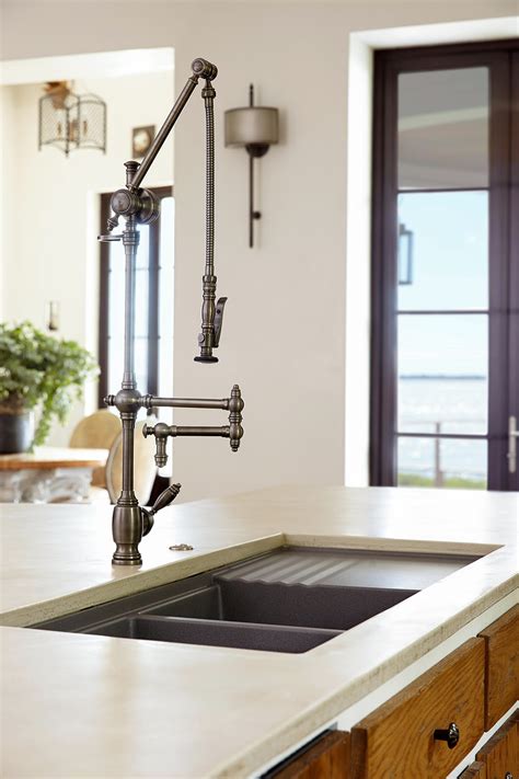 Our kitchen sink is in the island worktop and we like it there, it works for us considering the layout of our kitchen but also it faces a wonderful view of the outdoors. Kitchen Sinks & Faucets | Better Homes & Gardens
