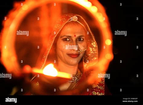 An Indian Married Woman Offers Prayers To The Moon For The Long Life Of Her Husband On The