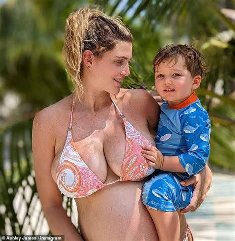 Pregnant Ashley James Shows Off Her Blossoming Bump In A Busty Bikini As She Cradles Her Son