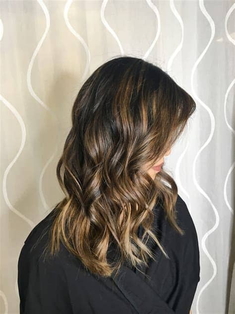 Young woman having haircut at beauty salon. tallulah east collective | salt lake city, UT | bellevue ...