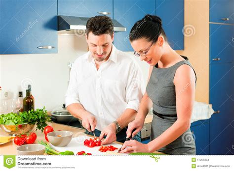Couple Cooking Together In Kitchen Stock Images Image