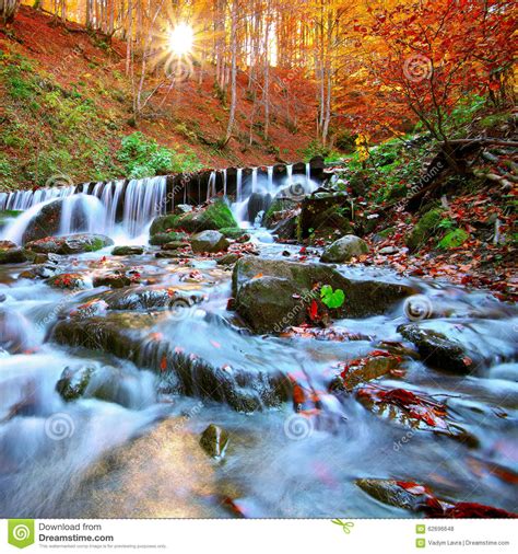 Beautiful Waterfall In Forest At Sunset Stock Photo