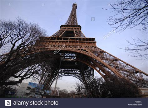A View Of The Eiffel Tower Overlooking The City Of Paris On The River