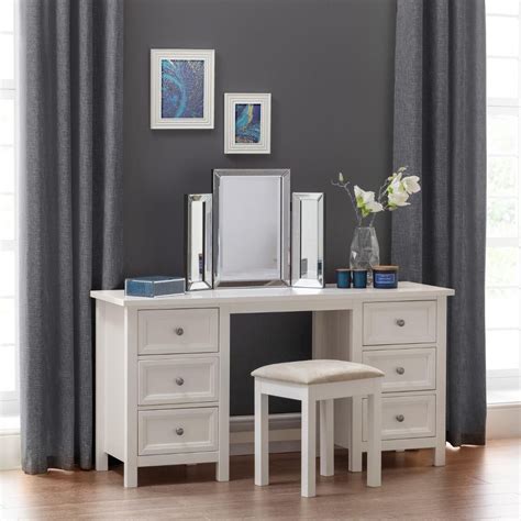 Choose a piece with plenty of drawers to keep all your cosmetics neat and organised, or go for a petite option to save space in. Maine White Wooden Double Pedestal Dressing Table