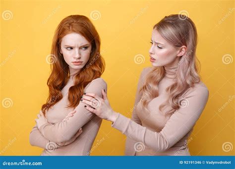 Angry Offended Redhead Lady Standing Near Blonde Woman Friend Stock