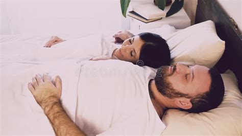 A Man And A Woman Sleeping Next To Husband And Wife Stock Video Video Of Caucasian 6064years