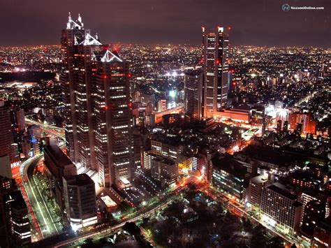 Online Crop Aerial View Of City Skyline Under Black Sky During
