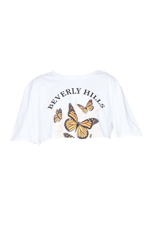 white beverly hills butterfly printed crop t shirt prettylittlething ie