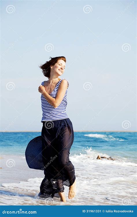 Beautiful Tanned Woman Resting On The Beach In Summer Day Stock Image