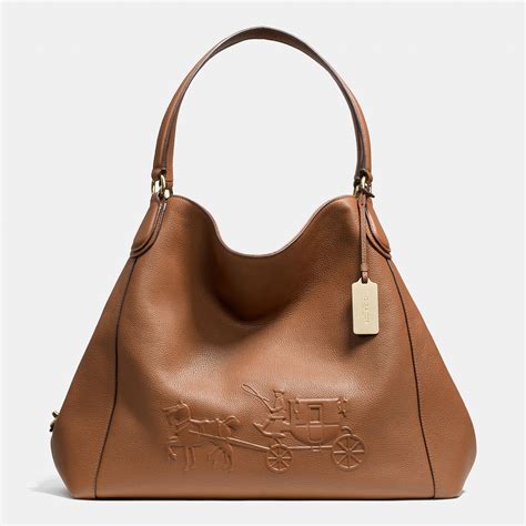 Coach Embossed Horse And Carriage Large Edie Shoulder Bag In Pebble
