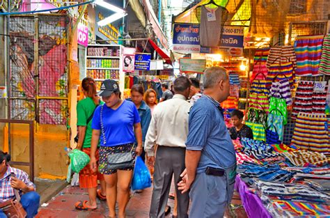 Bazaar Stalls In A Crowded And Bustling Narrow Street Of Bangkok