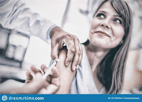 Doctor Giving An Injection To The Patient Stock Photo Image Of