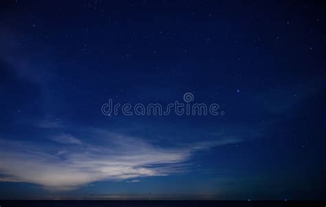 Starry Night Sky Over Calm Sea Beach Stock Image Image Of Clouds