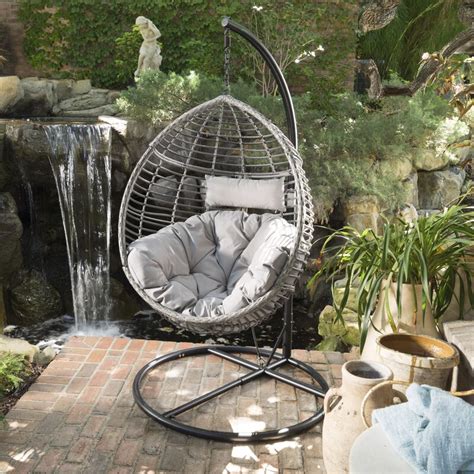 One (1) hanging basket chair with cushions. Weller Outdoor Wicker Basket Swing Chair with Stand ...