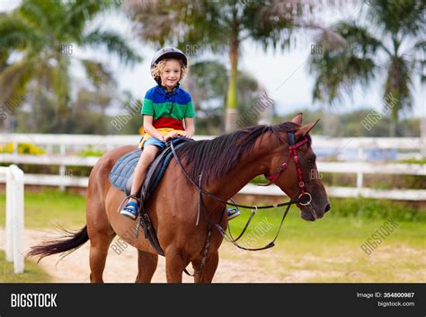 Kids Ride Horse Child Image And Photo Free Trial Bigstock
