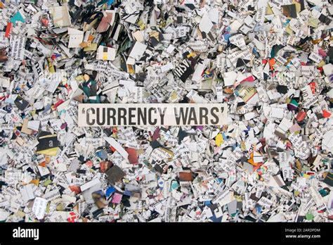 Newspaper Confetti From Above With The Word Currency Wars Background