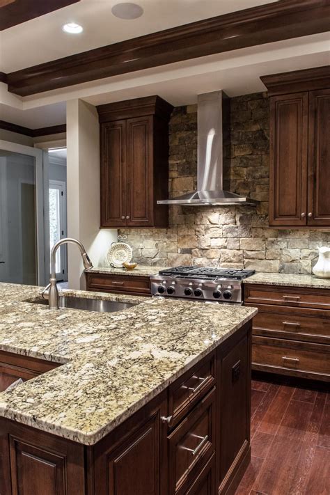 With dark gray cabinets and exposed wood countertops, your kitchen will have natural warmer and lighter features. Custom wood cabinets and gray, stone countertops are top ...