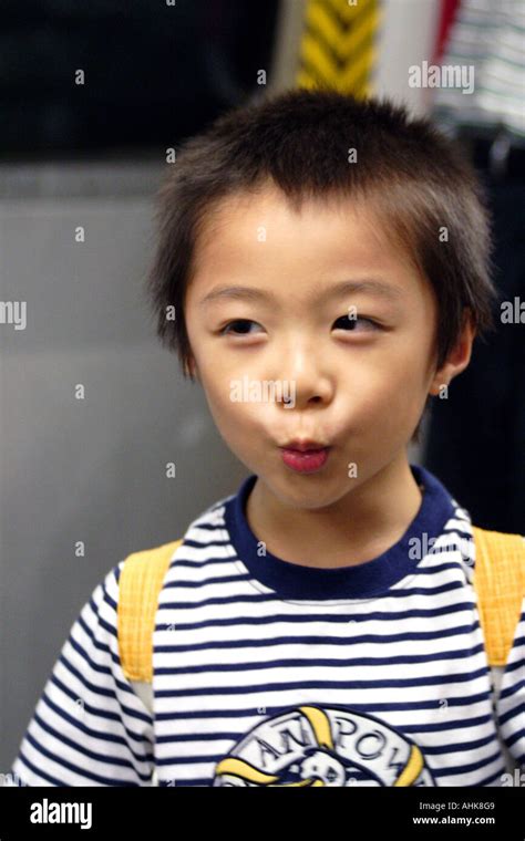 Cute Young Asian Boy Making Faces Hong Kong Stock Photo Alamy