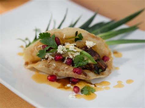 Chef and restaurateur bobby flay offers recipes for spaghetti & meatballs with ricotta, chicken soup, and chicken salad. Pork and Pomegranate Puffy Tacos Recipe | Bobby Flay ...