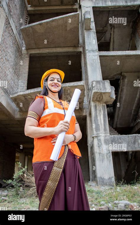 Portrait Of Confident Young Beautiful Indian Female Civil Engineer Or