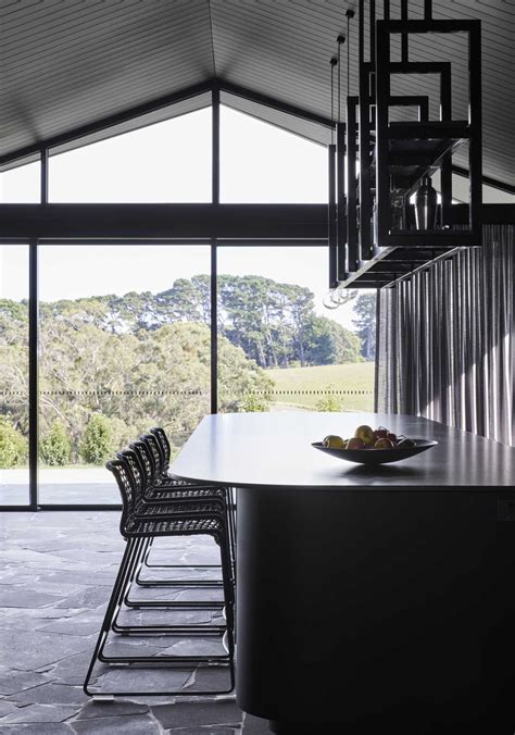 Pitched Roofs Cover This Dark And Moody Farmhouse