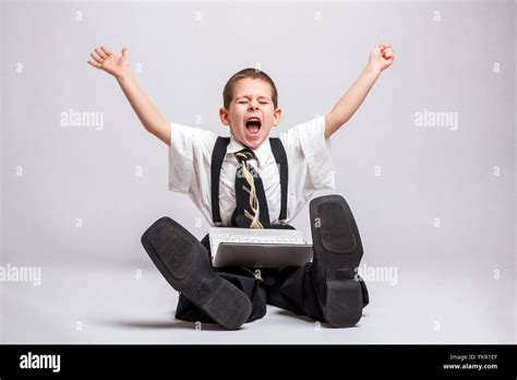 Happy Little Business Boy With A Laptop Stock Photo Alamy