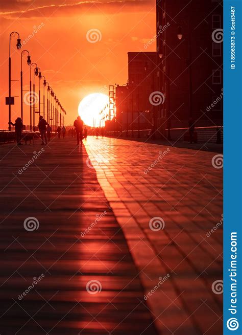 The Sun Setting Over A Long Boardwalk Long Beach New York Editorial