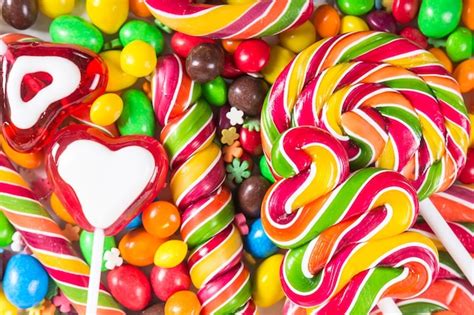 Premium Photo Background With Colorful Candies And Lollipops