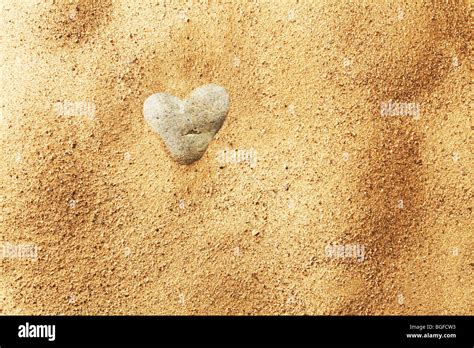 Heart Shaped Stone In Sand Stock Photo Alamy