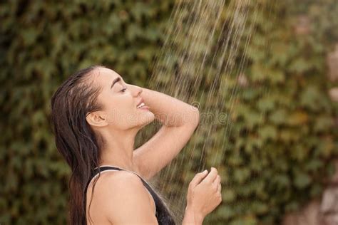 Woman Washing Hair In Outdoor Shower On Summer Day Stock Photo Image