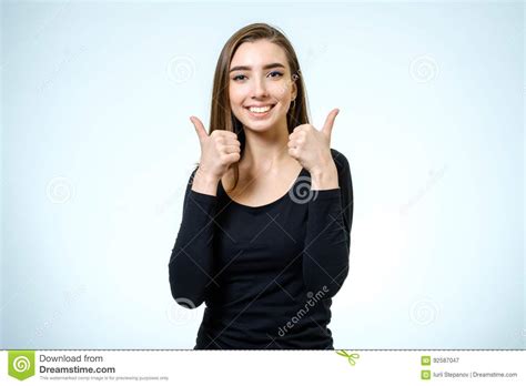 Smiling Happy Young Brunette Woman Showing Thumbs Up Gesture Stock